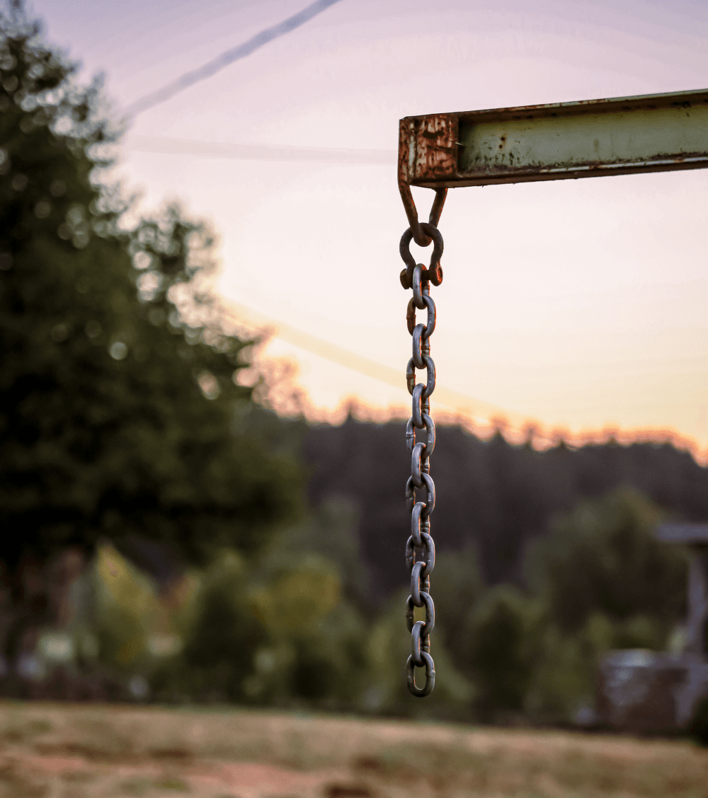 Chain hanging on a steel beam